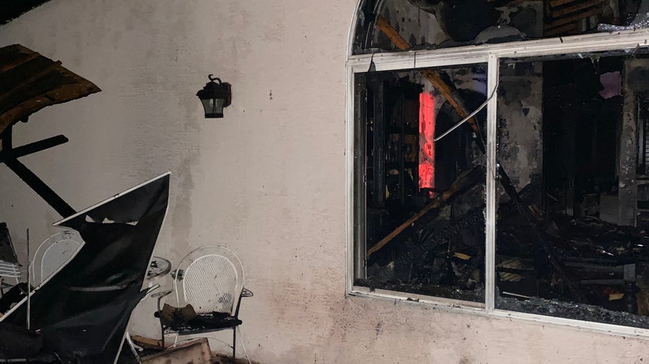 A closeup of the destroyed interior of the home. 