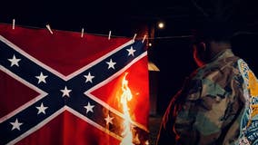 Louisiana Senate candidate burns Confederate flag in latest ad