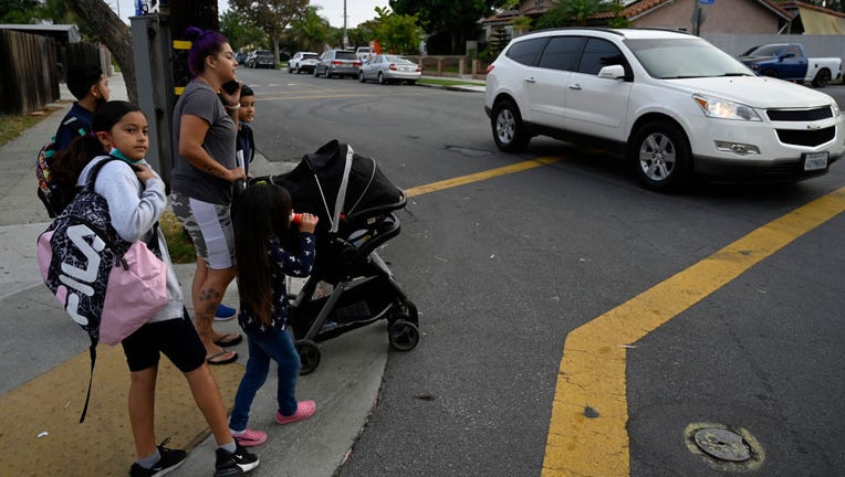 Family in crosswalk