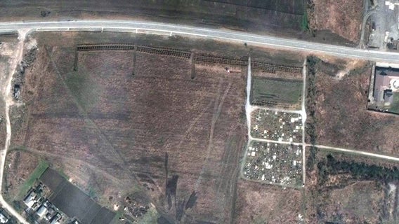 Satellite photos show possible mass graves near Mariupol as Russia attacks in east