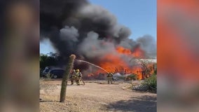 2 people hurt after fire destroys 2 homes in north Phoenix