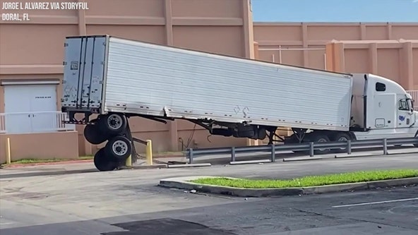 Impatient Florida truck driver loses back wheels by driving over concrete pillars