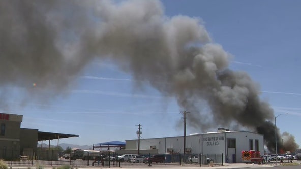 Firefighters battle scrap yard fire in Phoenix