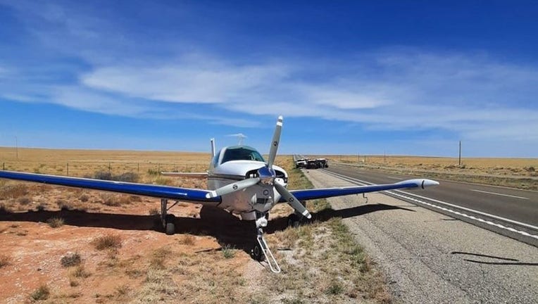 9a85e4a0-Plane lands on highway