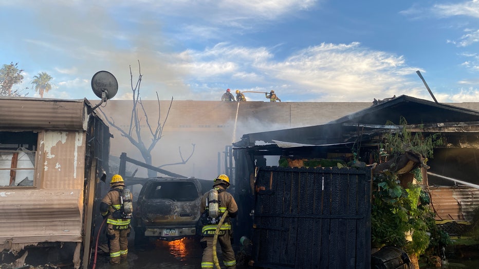 Phoenix firefighters extinguished a double mobile home fire on Sunday.