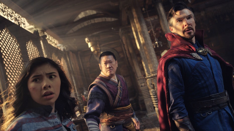 (L-R): Xochitl Gomez as America Chavez, Benedict Wong as Wong, and Benedict Cumberbatch as Dr. Stephen Strange in Marvel Studios' DOCTOR STRANGE IN THE MULTIVERSE OF MADNESS. Photo courtesy of Marvel Studios. ©Marvel Studios 2022. All Rights Reserved.