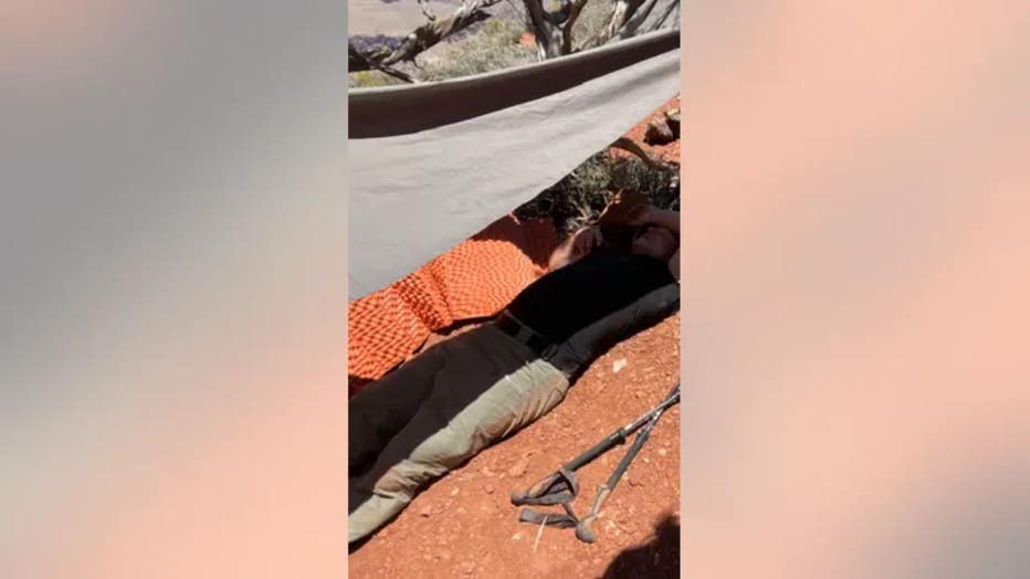 A hiker who took ill recently in the Grand Canyon is shown lying down here.