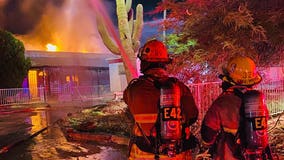 Over 50 firefighters battle house fire in north Phoenix; 2 people displaced