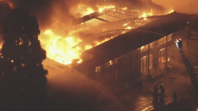 Crews knock down massive warehouse fire in Woodland Hills