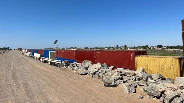 Migrants at Arizona border unhindered by shipping container wall