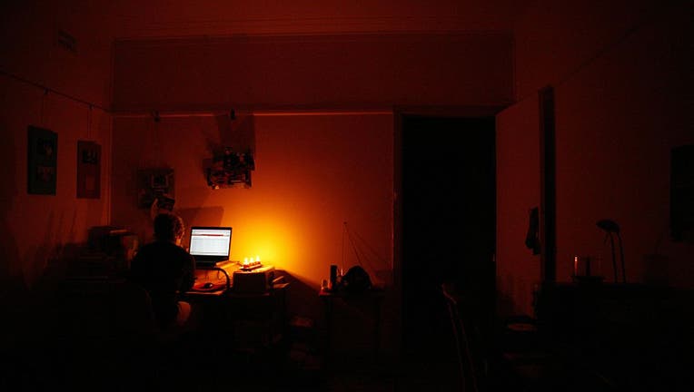 A woman works on a computer at home, 23 April 2006. AFR Picture by ANDREW QUIL