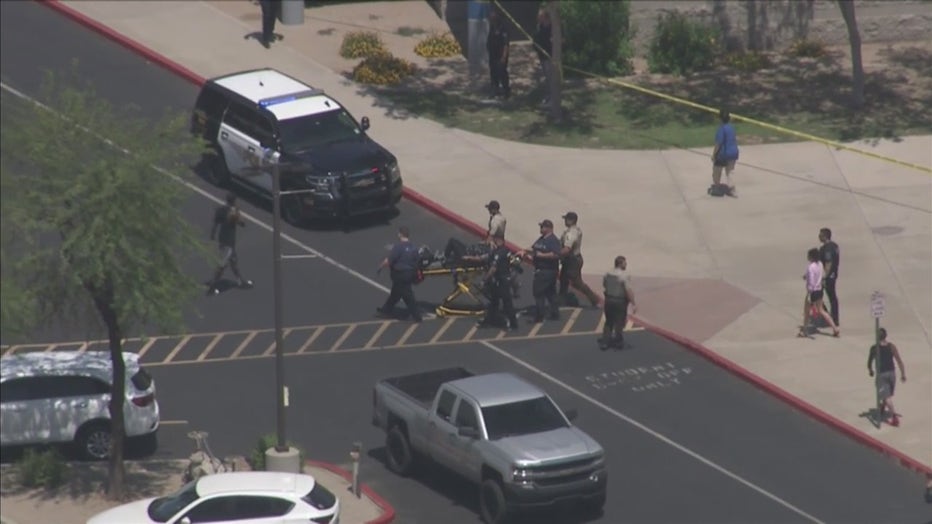 A man was seen being carted out on a stretcher.