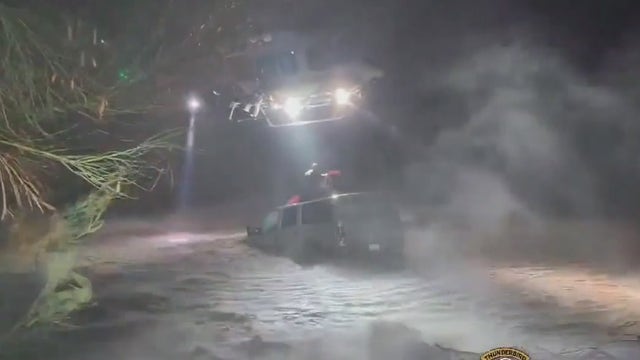 Arizona helicopter crew rescues family stuck on car's roof during flood