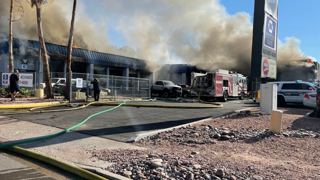 Firefighters battle fire at north Phoenix auto repair shop