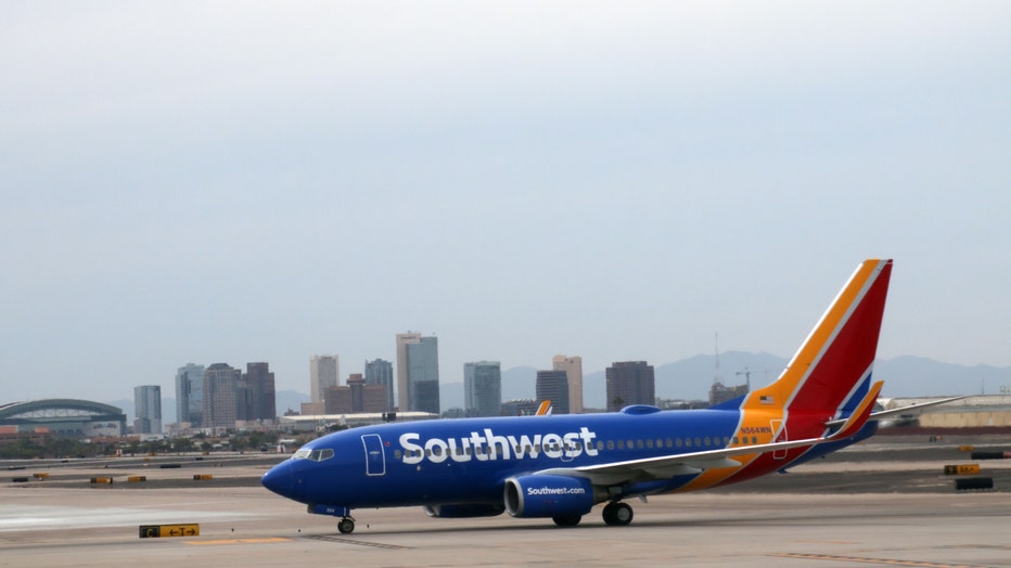 A Southwest airline plane is seen on the tarmac at Phoenix Sky Harbor International Airport (DANIEL SLIM/AFP via Getty Images)