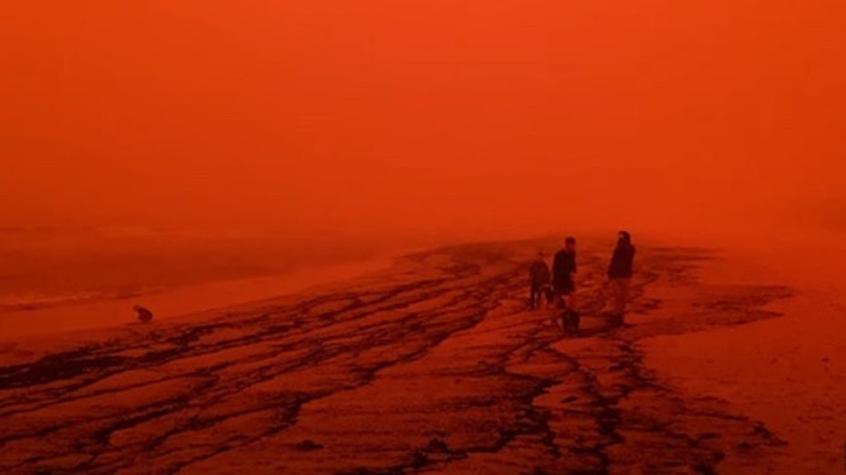 Red Skies and Black Ash Washes Up at Merimbula Beach as Bushfire Rages on New South Wales South Coast