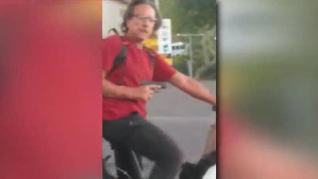 Phoenix man captured on camera aiming a gun at witnesses in a parking lot