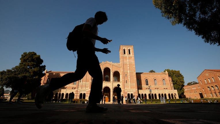 183cd6a2-Students and lecturers gathered at UCLA Bruin Plaza to celebrate with s rally after a strike was averted Wednesday morning. Lecturers across the UC system were planning to strike Wednesday and Thursday over unfair labor practices.