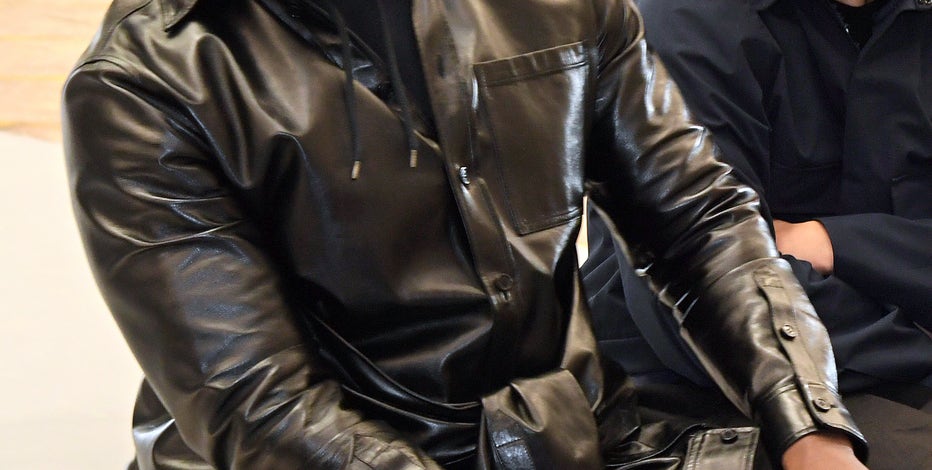 Kanye West wearing White Lives Matter shirt during his Yeezy show