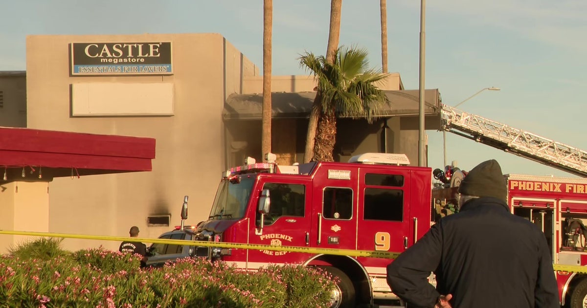 Fire crews battle fire at Phoenix adult boutique; man arrested by ...