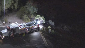 Police chase ends in car driving off 200-foot embankment into Salt River bottom