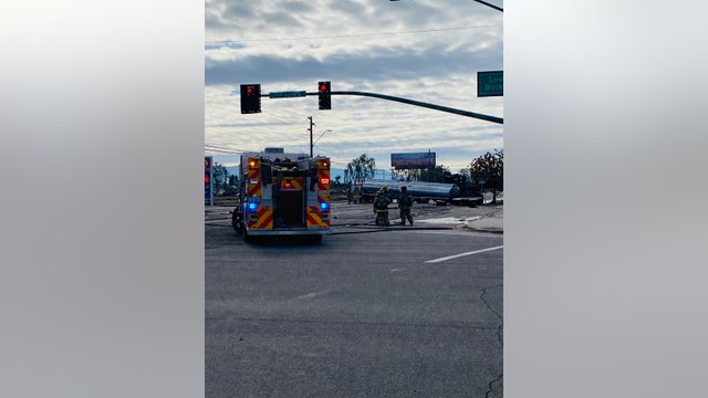 Gasoline tanker crash in Phoenix causes major fuel leak on roadway, driver severely hurt