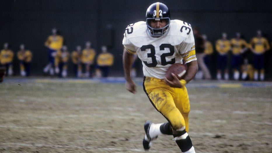FILE - CIRCA 1972: Running back Franco Harris #32 of the Pittsburgh Steelers plays carries the ball circa 1972 during an NFL football game. Harris played for the Steelers from 1972-83. (Photo by Focus on Sport/Getty Images)