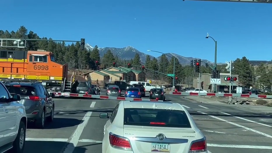 Train smashes car partially on railroad in Flagstaff, several people  narrowly missed