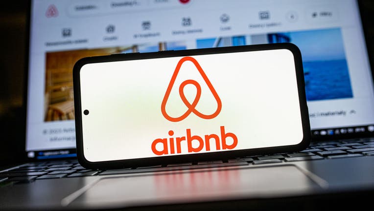 8c2f33b3-In this photo illustration an Airbnb logo seen displayed on