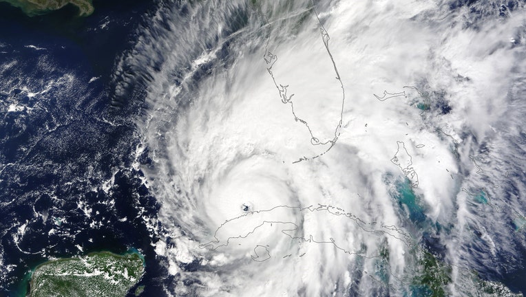 In this NASA handout image taken by Moderate Resolution Imaging Spectroradiometer (MODIS) on NASA’s Terra satellite, Hurricane Ian enters the Gulf of Mexico on September 27, 2022, just hours after it moved off the northwest coast of Cuba. (Photo by NASA via Getty Images)