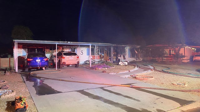 Phoenix Firefighter injured, resident displaced after double wide trailer catches fire