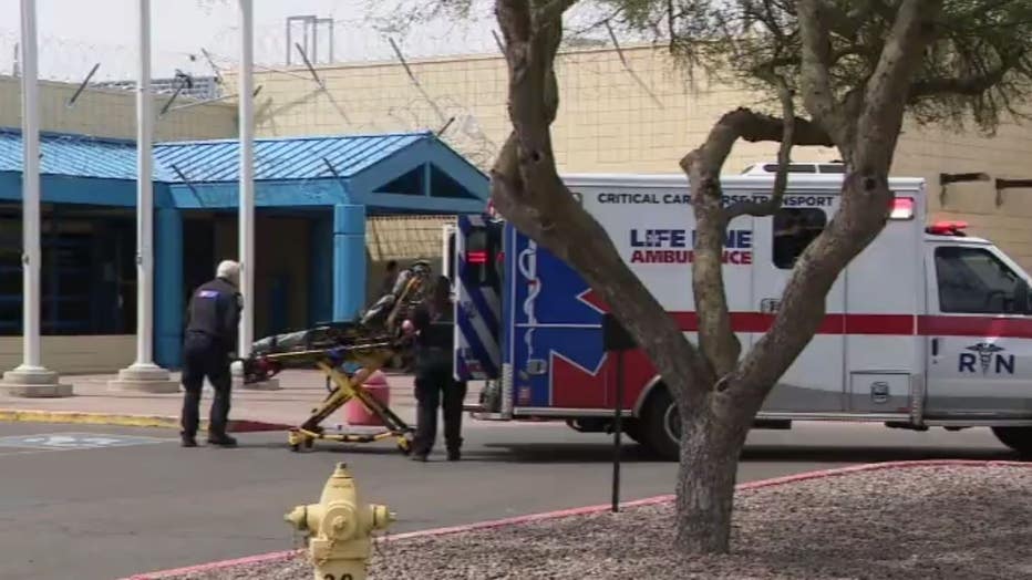 A stretcher is carried out of an ambulance after a series of reported overdoses at Estrella County Jail.