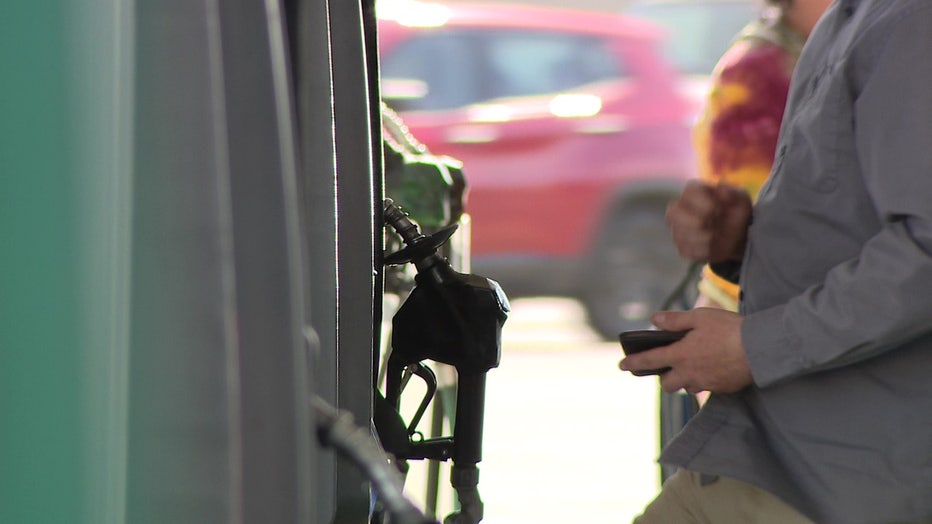A gas gun at a gas pump.