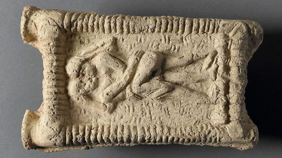 Babylonian clay model showing a nude couple on a couch engaged in sex and kissing. Date: 1800 BC. (Credit: The Trustees of the British Museum)