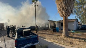 Phoenix firefighter hurt, 12 displaced after double house fire