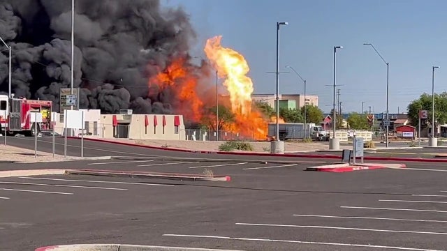 Explosions seen as large fire burns at Phoenix propane business