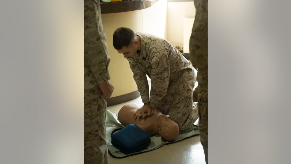 Petty Officer 3rd Class Joshua White, a corpsman with Combat Logistics Company 36, demonstrates the proper way to deliver chest compressions during the Heartsavers class at Corporals Course. (Photo by Alissa Schuning)