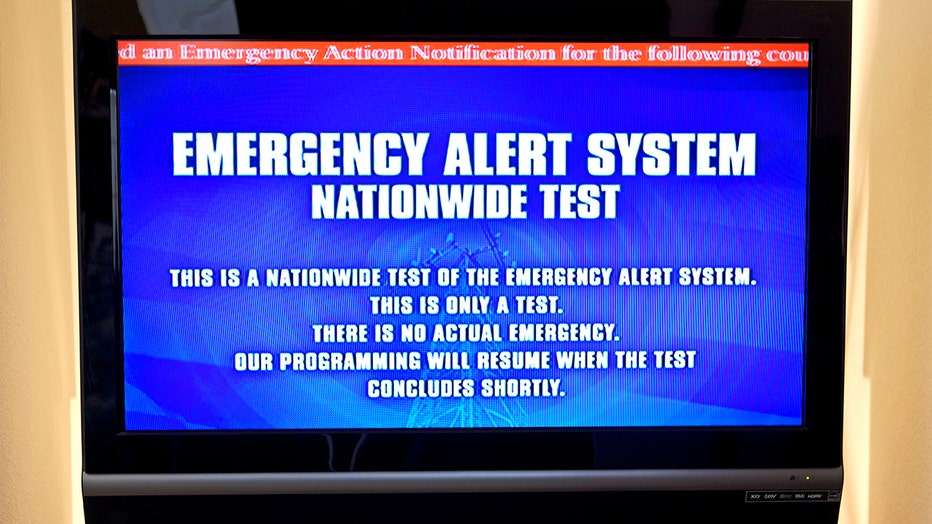 A television screen displays messages during a test of the Nationwide Emergency Alert System (EAS). (Photo by Kim Kulish/Corbis via Getty Images)