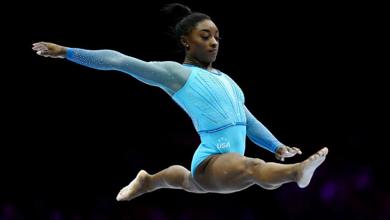 Simone Biles leads US women's team to gymnastics world