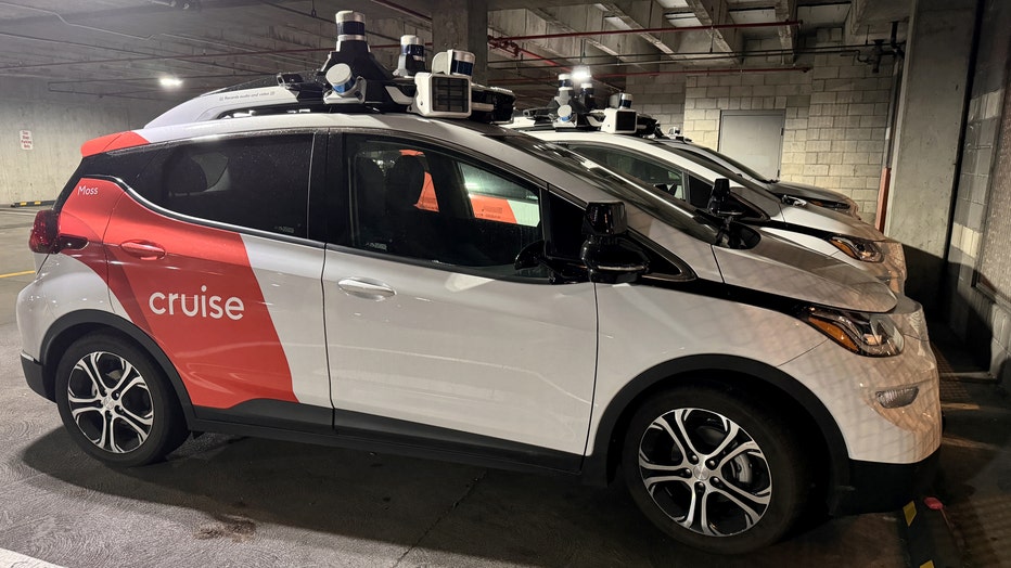 Cruise driverless robot taxis are seen at a parking lot (Photo by Tayfun Coskun/Anadolu via Getty Images)