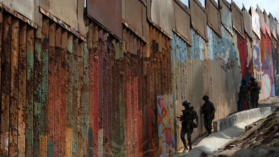 Mexicos Navy officers patrol in Playas de Tijuana near the US/Mexico border, Baja California State, Mexico. (Photo by GUILLERMO ARIAS/AFP via Getty Images)