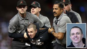 Man arrested for running on field during Game 4 of World Series