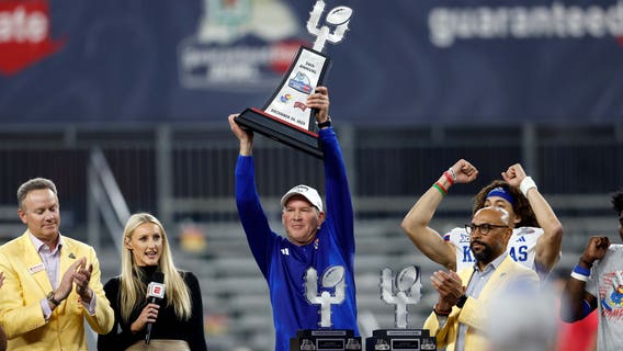 Bean throws for 6 TDs, Kansas overcomes flags to beat UNLV 49-36 in Guaranteed Rate Bowl