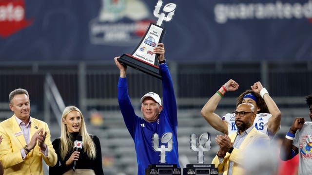 Bean throws for 6 TDs, Kansas overcomes flags to beat UNLV 49-36 in Guaranteed Rate Bowl