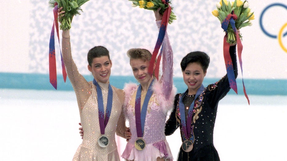 silver medalist Nancy Kerrigan of the U.S.A, gold medalist Oksana Baiul of Ukraine and bronze medalist Chen Lu of China