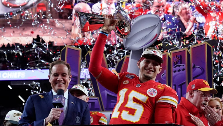 Kansas City Chiefs quarterback #15 Patrick Mahomes celebrates with the trophy after the Chiefs won Super Bowl LVIII against the San Francisco 49ers at Allegiant Stadium in Las Vegas, Nevada, Feb. 11, 2024. (Photo by TIMOTHY A. CLARY/AFP via Getty Images)