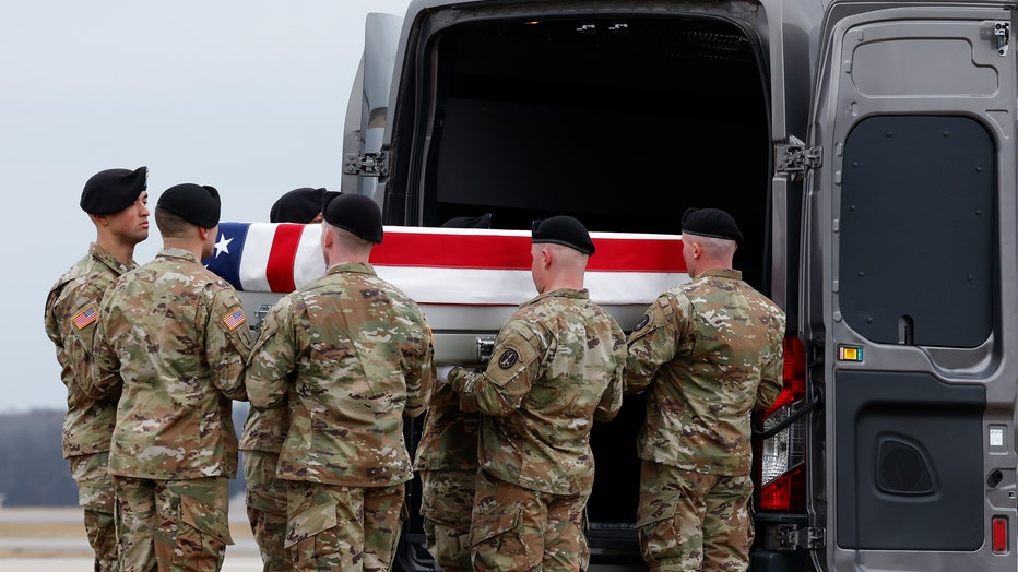 A U.S. Army carry team moves a flagged draped transfer case containing the remains of Army Sgt. William Rivers during a dignified transfer at Dover Air Force Base on February 02, 2024 in Dover, Delaware. U.S. (Photo by Kevin Dietsch/Getty Images)