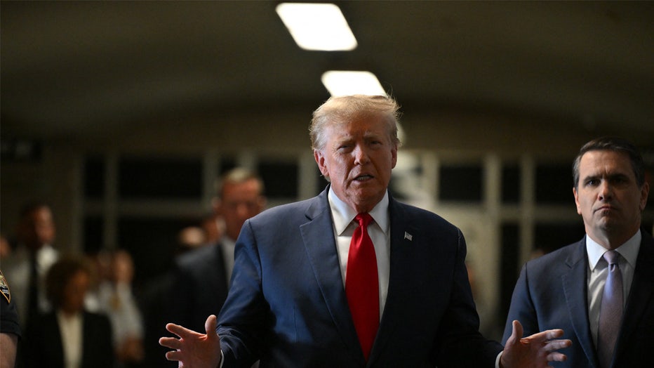 Former US President Donald Trump speaks to the press as he arrives at Manhattan Criminal Court for a hearing in his case of paying hush money to cover up extramarital affairs in New York City on February 15, 2024. Trump is in court ahead of a trial for illegally covering up hush money payments made to hide extramarital affairs, including with porn star Stormy Daniels. The hearing will see Trump's legal team attempt to have the case thrown out. (Photo by ANGELA WEISS / AFP) (Photo by ANGELA WEISS/AFP via Getty Images)