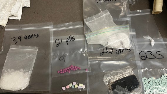 'Drug dealer' found passed out inside car and has drugs, gun seized, Peoria PD says