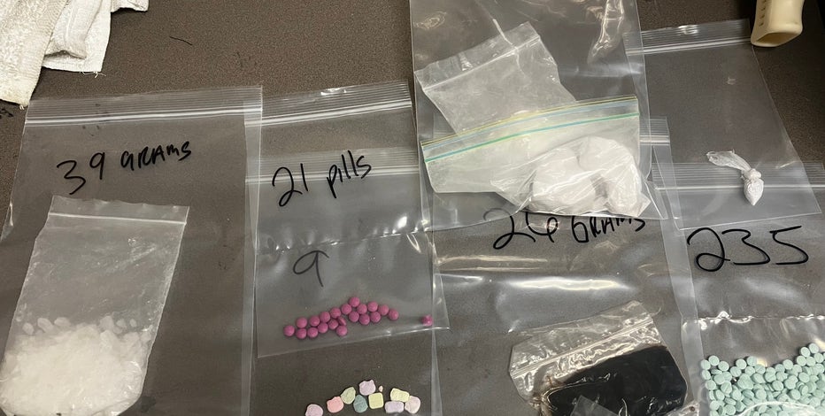 'Drug dealer' found passed out inside car and has drugs, gun seized, Peoria PD says